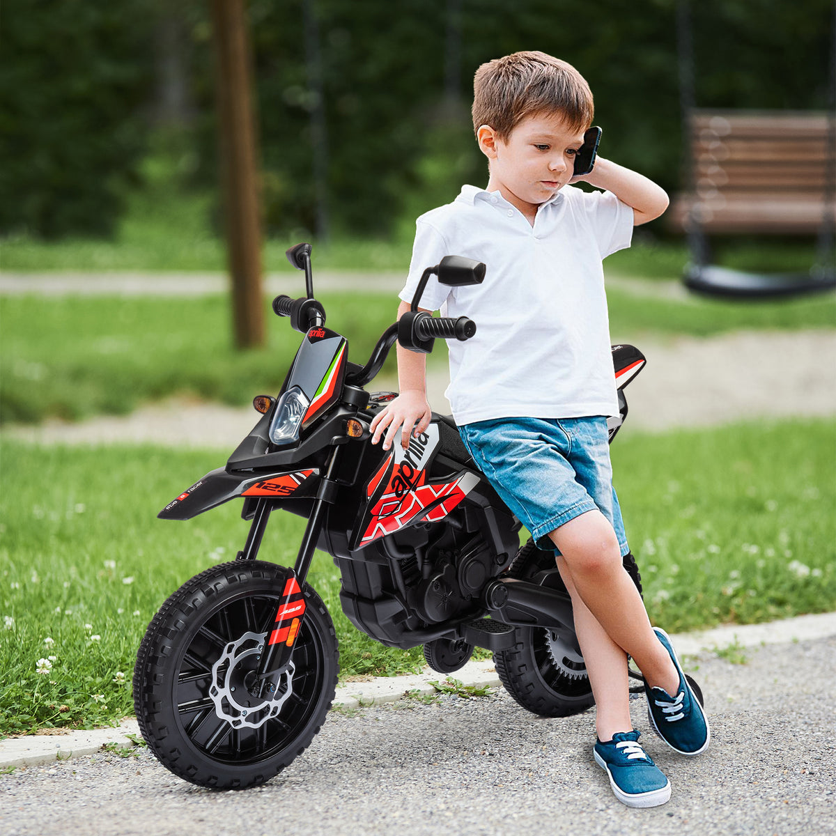 Moto électrique enfants sous licence Aprilia avec 2 moteurs 12V, roues d'entraînement, lumière LED, musique - rouge